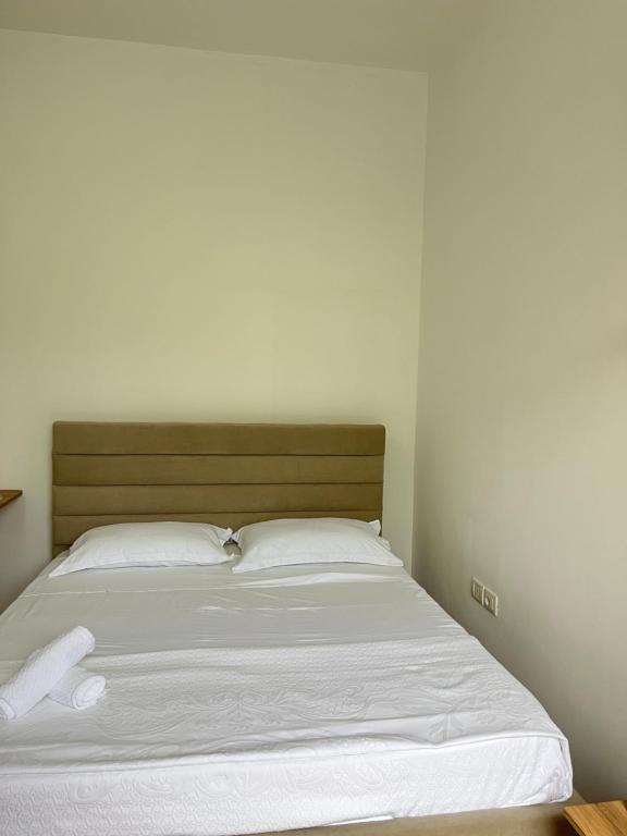 Postel nebo postele na pokoji v ubytování Blossom Apartments
