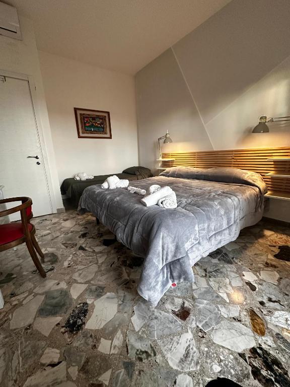 Postel nebo postele na pokoji v ubytování B&B Tre Ponti