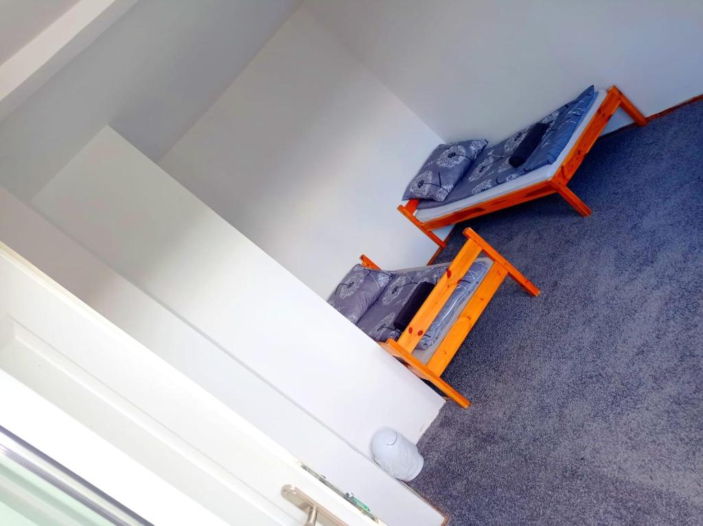 two chairs and a bed in a room at Gdańsk tanie noclegi pokój z balkonem z widokiem na morze nr 12 1-3 osobowy in Gdańsk