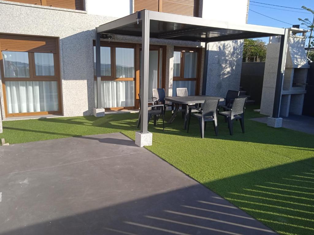 Vonkajšia záhrada v ubytovaní Casa Surf Lanzada