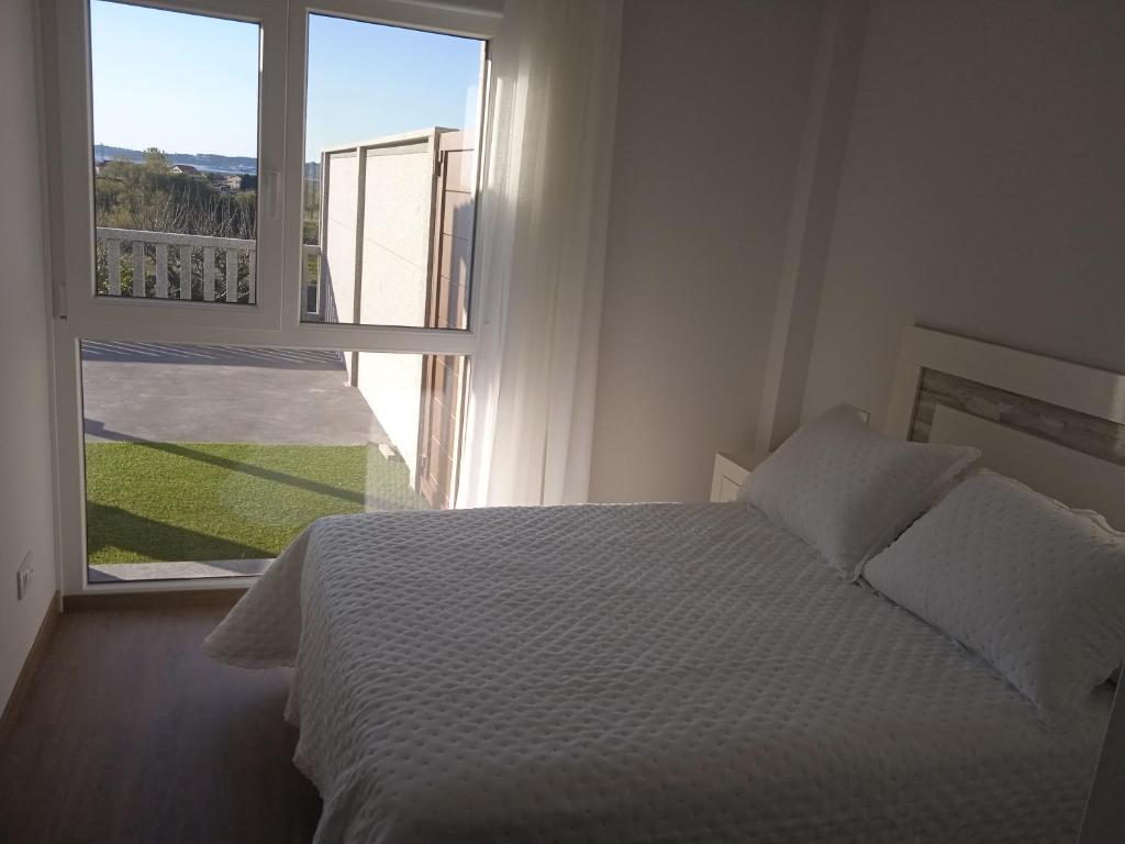 Posteľ alebo postele v izbe v ubytovaní Casa Surf Lanzada