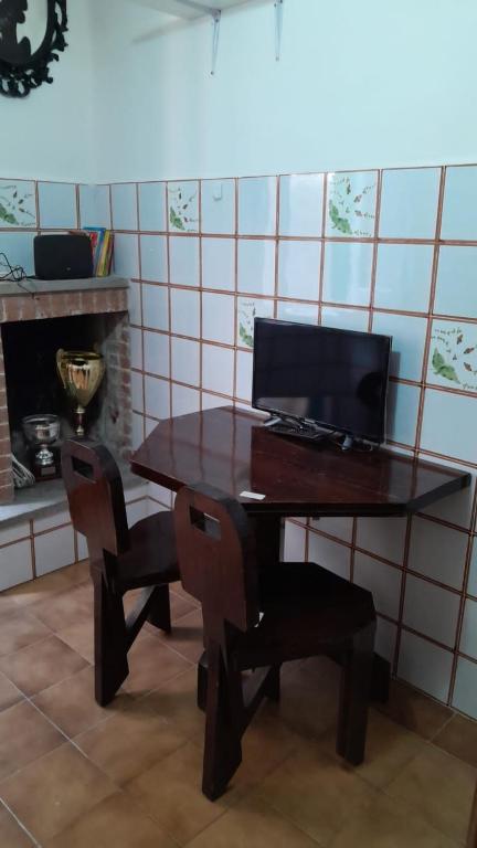 TV a/nebo společenská místnost v ubytování Casetta centro storico