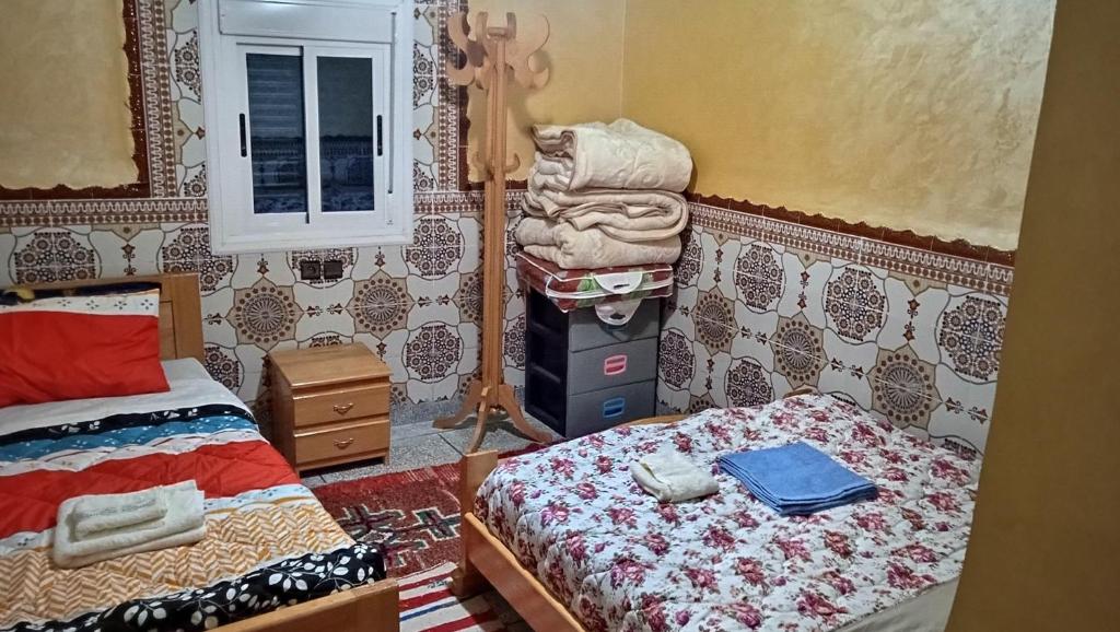 Postel nebo postele na pokoji v ubytování Auberge Cascade Imilchil