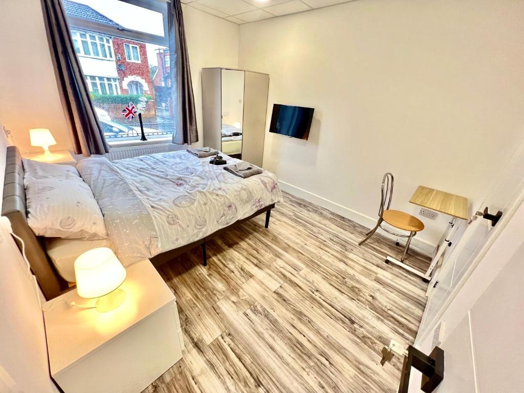 a bedroom with a bed and a window at Lux En-Suite COOP Arena ManCity Stadium Piccadilly in Manchester