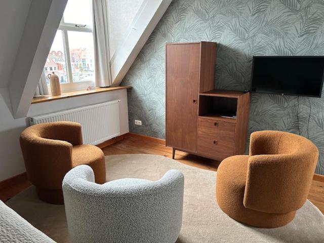 TV a/nebo společenská místnost v ubytování Hotel Stadsherberg Sneek
