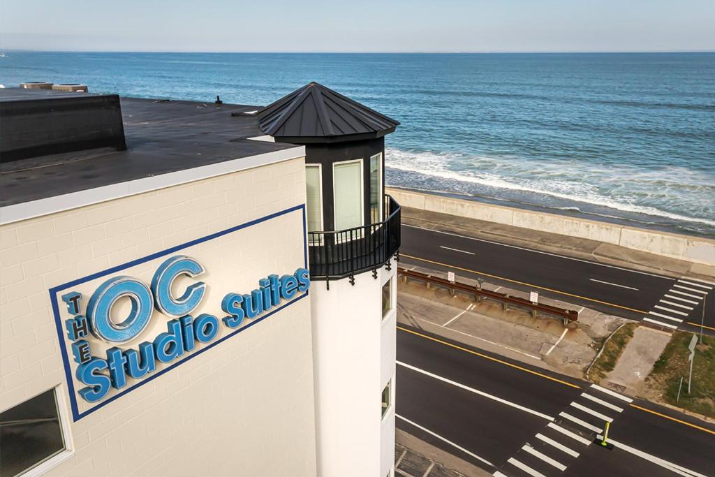 a sign on the side of a building next to the ocean at Direct Oceanfront Studio Suite! in Hampton