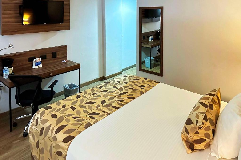 Postel nebo postele na pokoji v ubytování Sleep Inn Mazatlan