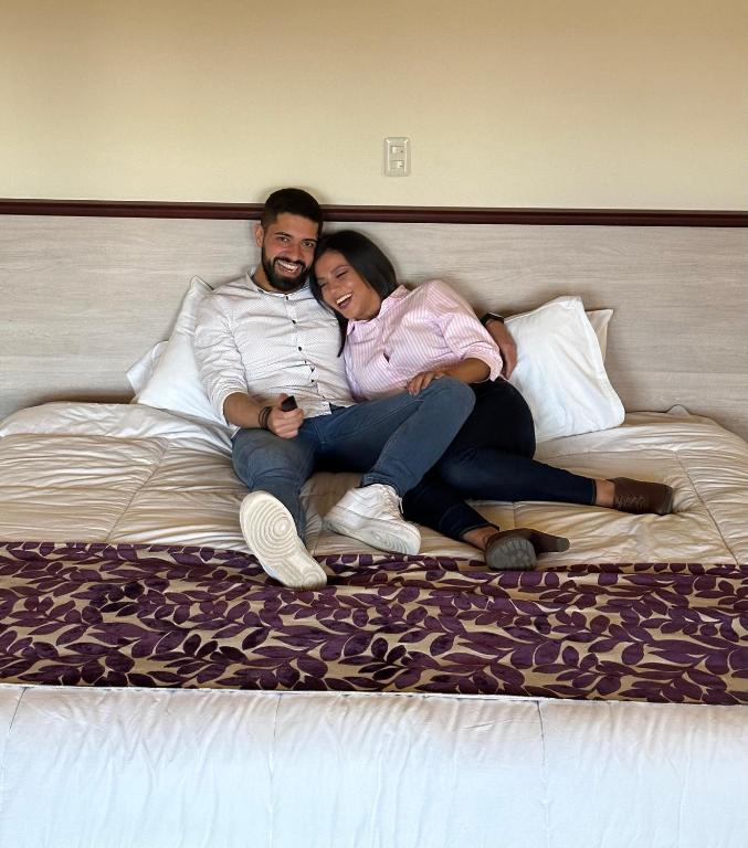 Postel nebo postele na pokoji v ubytování Minkana Hotel