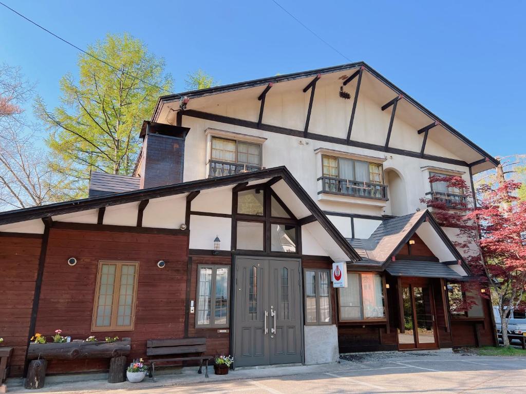 an old house with a gambrel roof at irodori in Matsumoto