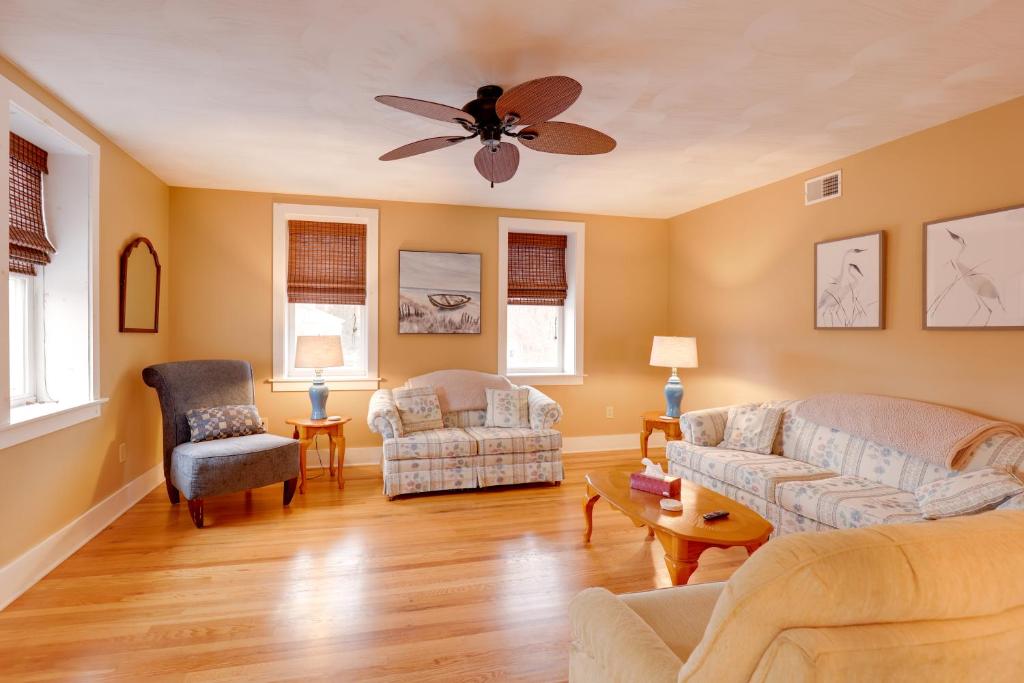 a living room with two couches and a ceiling fan at Finger Lakes Retreat 3 Mi to the Water! in Himrod