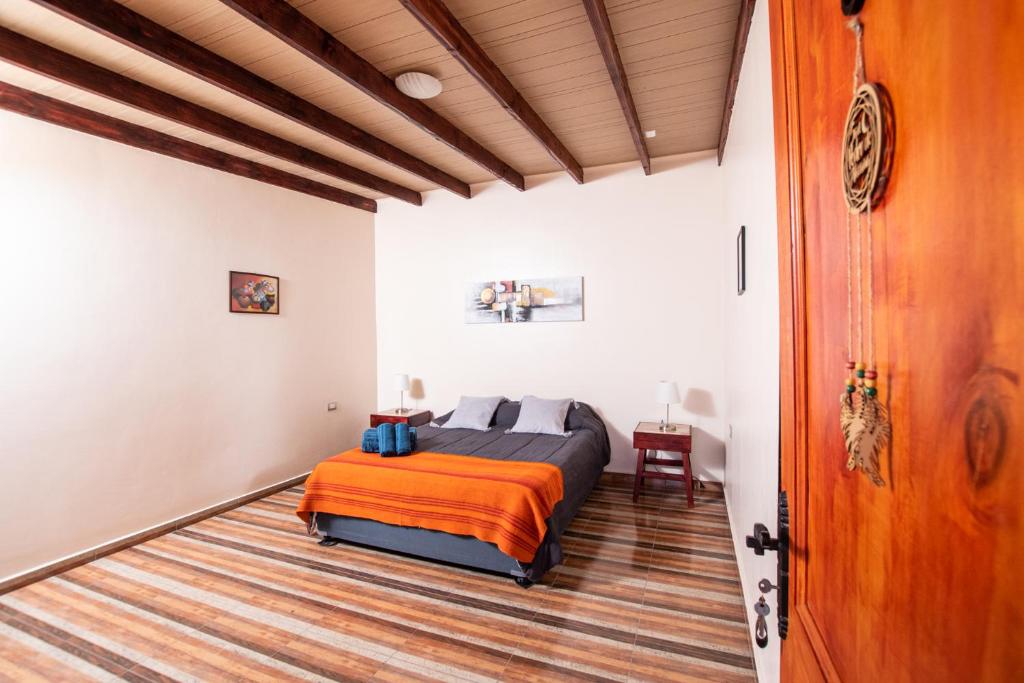 Postel nebo postele na pokoji v ubytování Hostal Belen