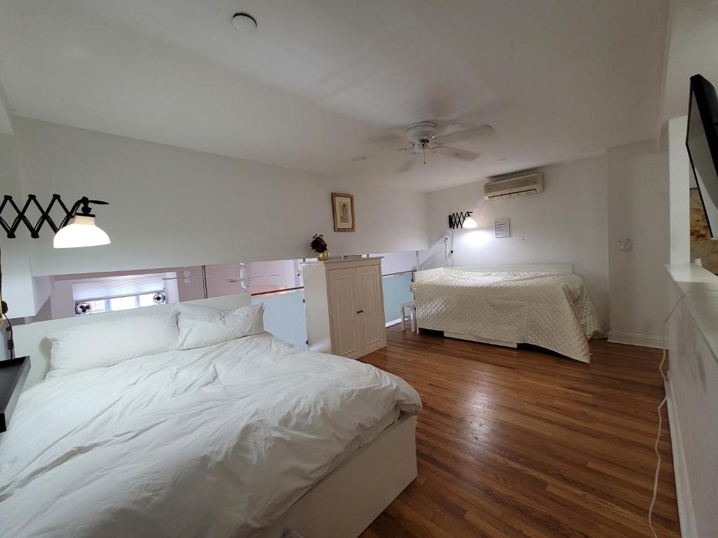 Postel nebo postele na pokoji v ubytování Duplex New York loft