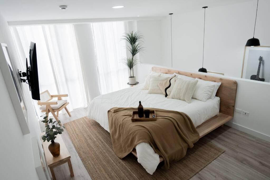 Postel nebo postele na pokoji v ubytování Departamento de estilo nórdico, terraza con asador
