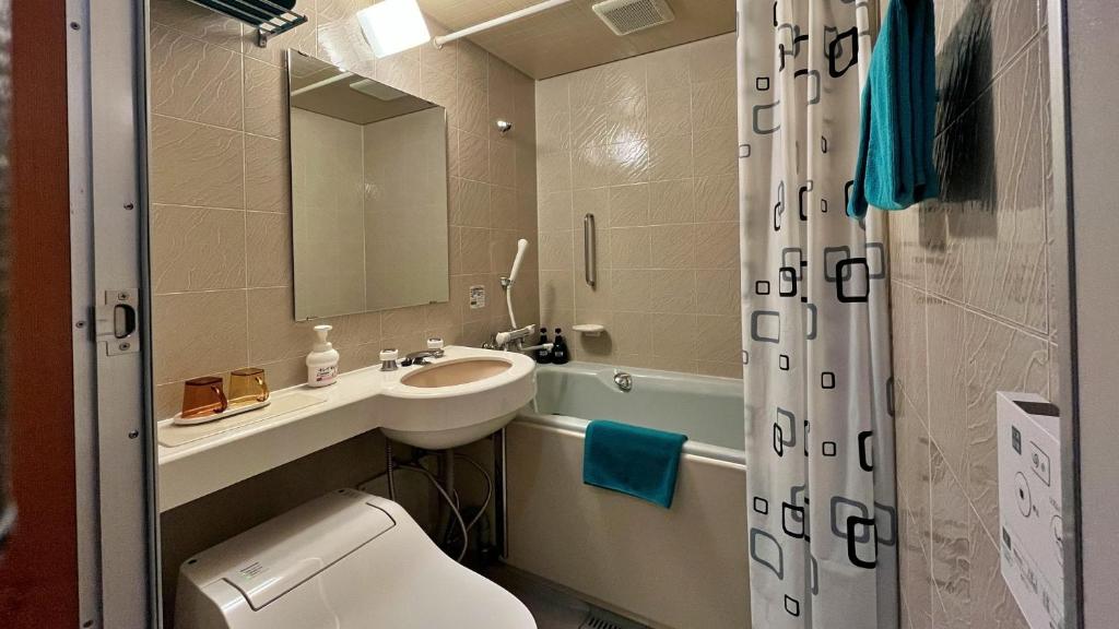 Koupelna v ubytování ペンション湖風 KOFU a lodging accommodation