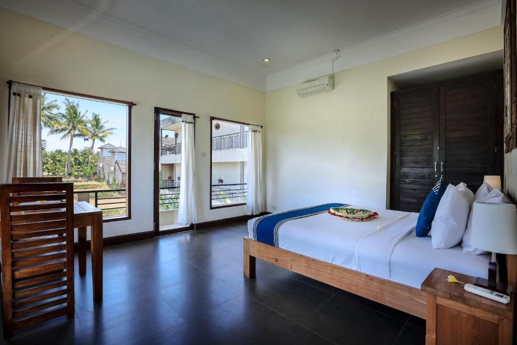 Postel nebo postele na pokoji v ubytování Nang Ade Villa by Pramana Villas
