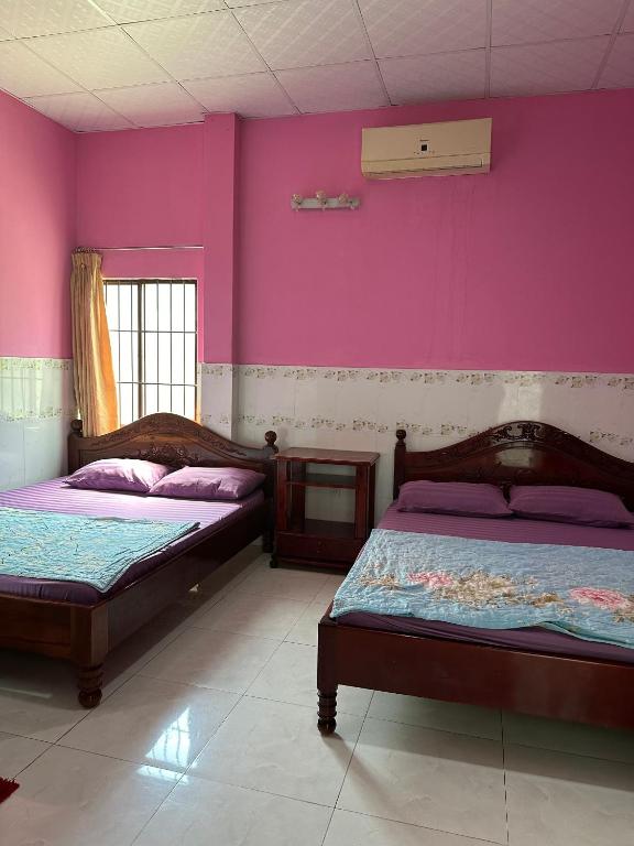 Postel nebo postele na pokoji v ubytování San Vuon Guesthouse