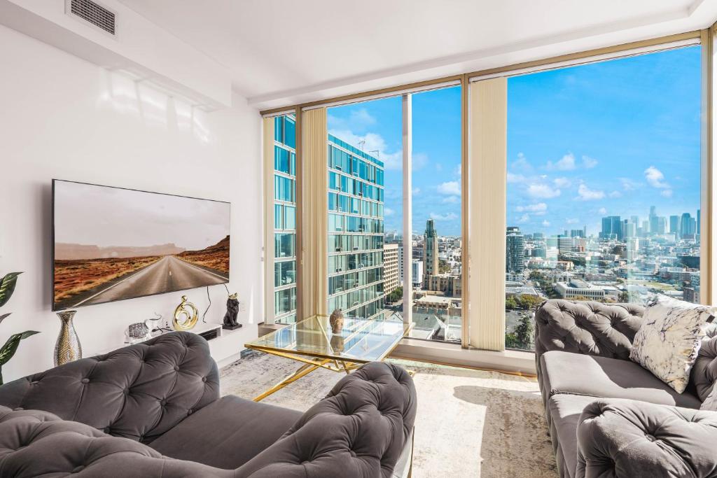 a living room with a view of a city at Beautiful 2 BR Sky View Apartment in Los Angeles