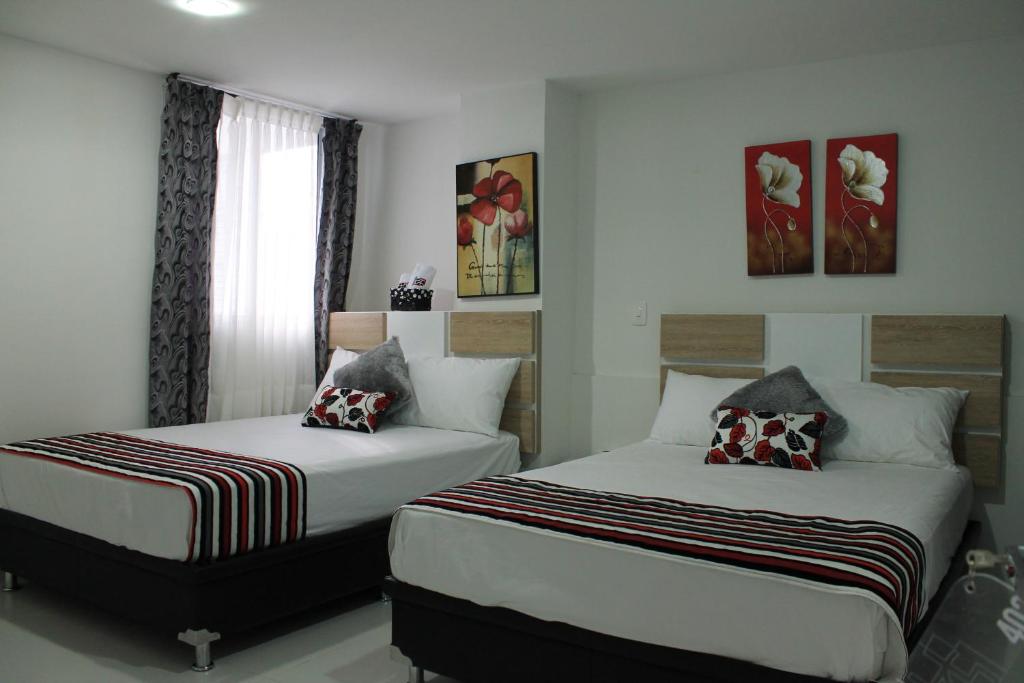 Postel nebo postele na pokoji v ubytování Hotel Guadalupe Plaza