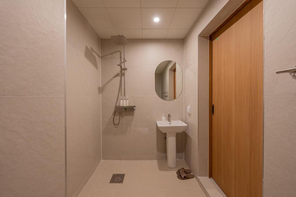 Koupelna v ubytování H-avenue Hotel Munhyeon