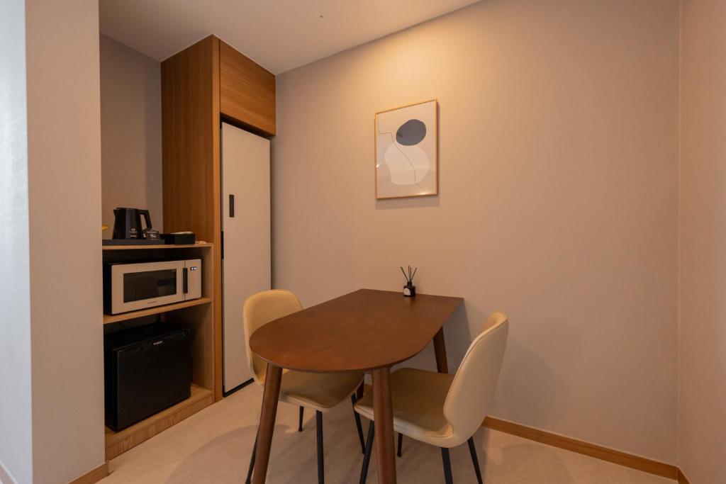 Kuchyň nebo kuchyňský kout v ubytování H-avenue Hotel Munhyeon