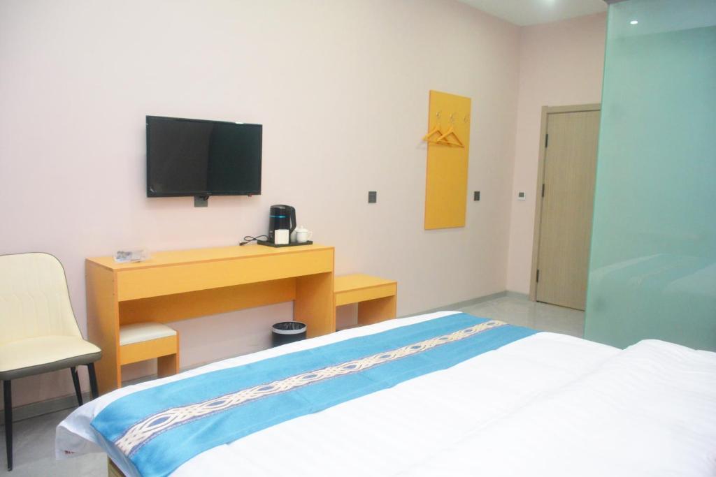 TV a/nebo společenská místnost v ubytování Hongge Hotel - Harbin Taiping Airport