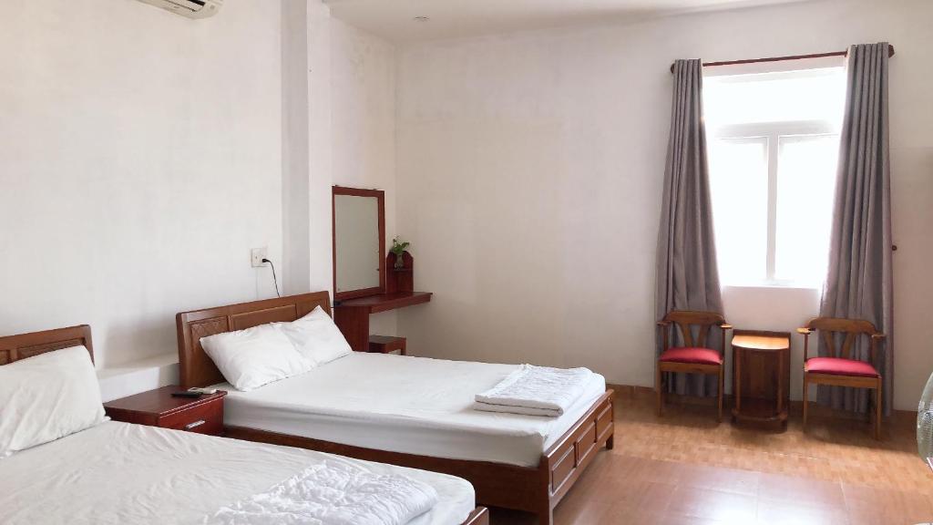 Postel nebo postele na pokoji v ubytování Motel Minh Thảo
