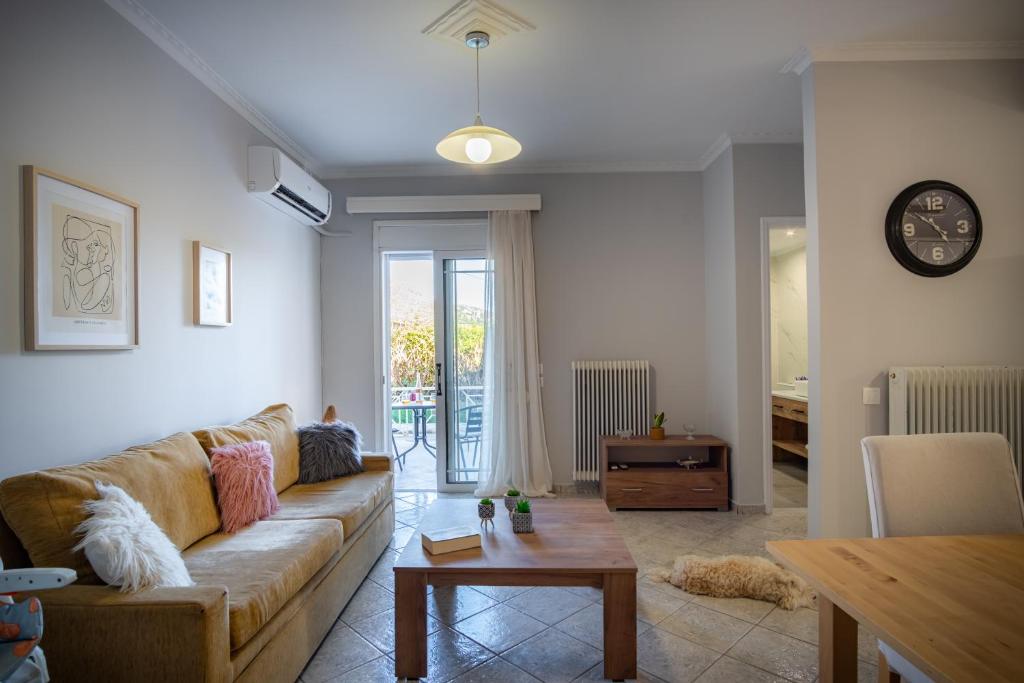 a living room with a couch and a table at Stefano's Home in Potokáki