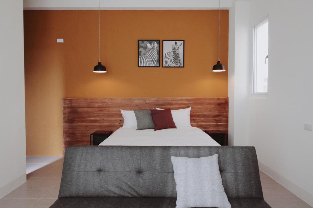 Postel nebo postele na pokoji v ubytování 沉靛旅宿 La Casa Indaco 墾丁夢幻島Villa