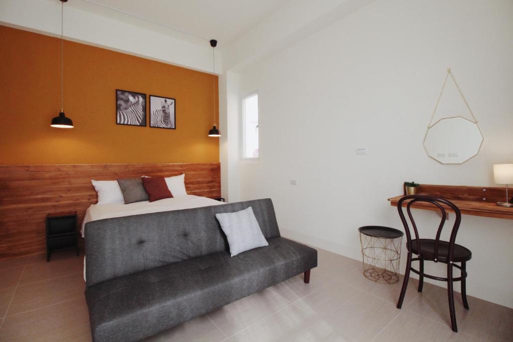 Postel nebo postele na pokoji v ubytování 沉靛旅宿 La Casa Indaco 墾丁夢幻島Villa