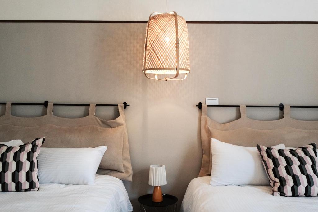Postel nebo postele na pokoji v ubytování 沉靛旅宿 La Casa Indaco 墾丁夢幻島Villa