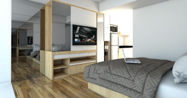 Schlafzimmer mit einem Bett und einem TV in der Unterkunft Apart Samudera 