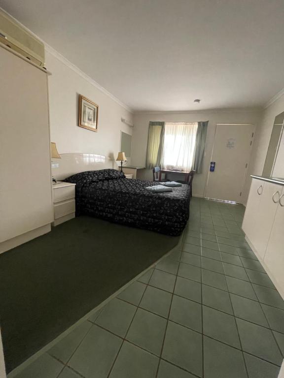 Postel nebo postele na pokoji v ubytování Warrego Motel