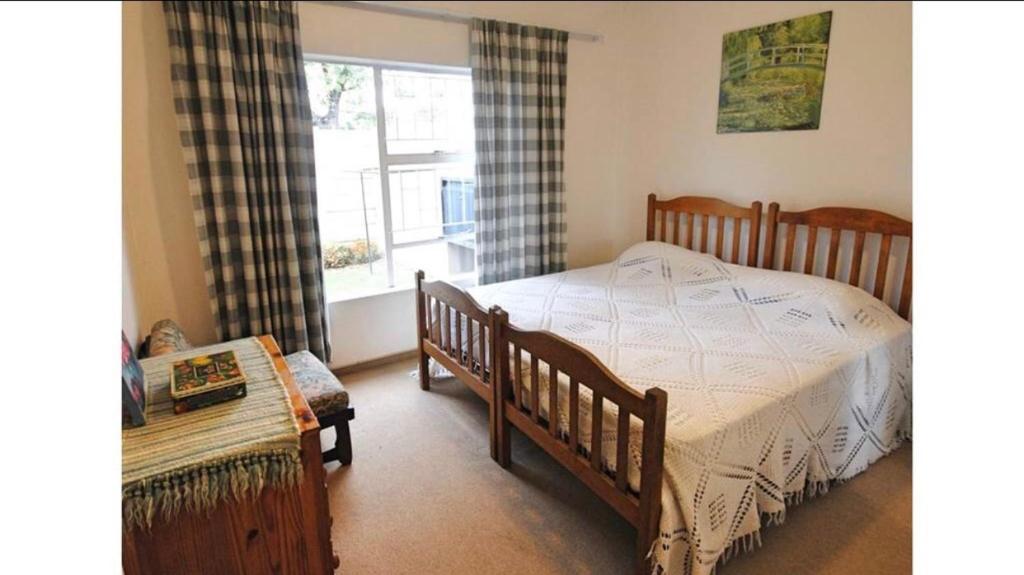 Llit o llits en una habitació de Oasis Guesthouse