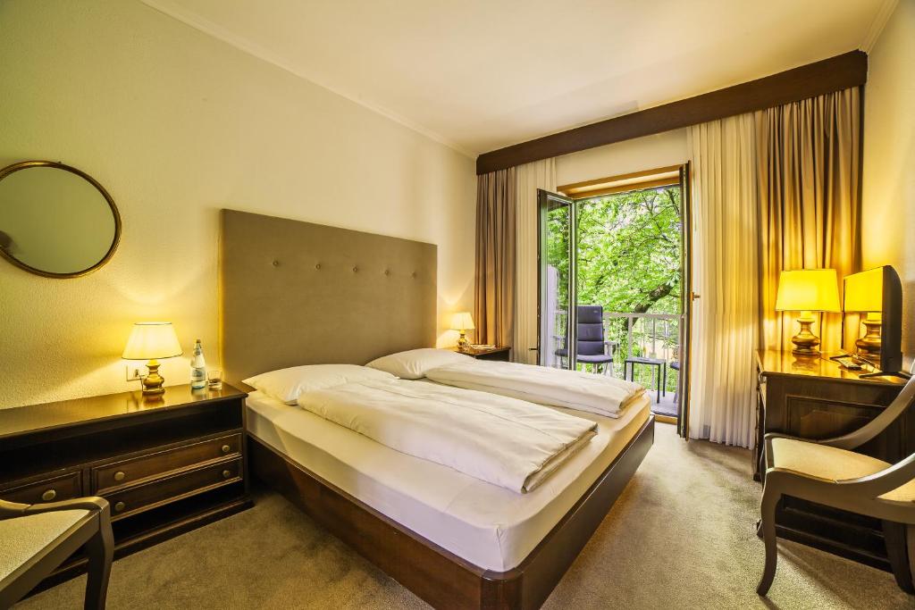 Postel nebo postele na pokoji v ubytování Hotel Isabella