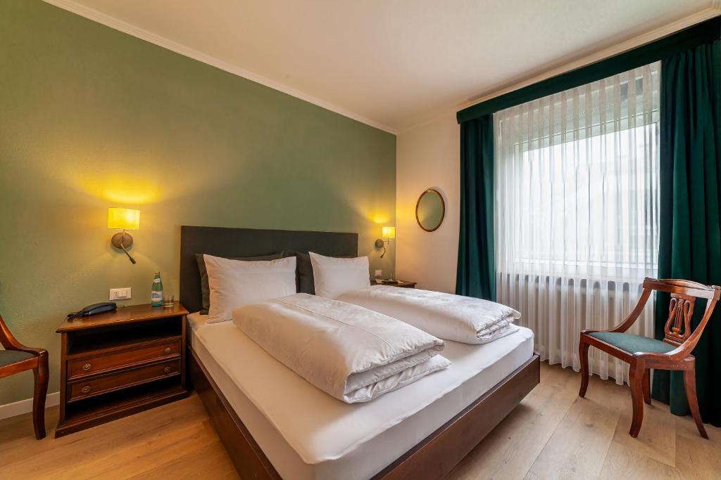 Postel nebo postele na pokoji v ubytování Hotel Isabella
