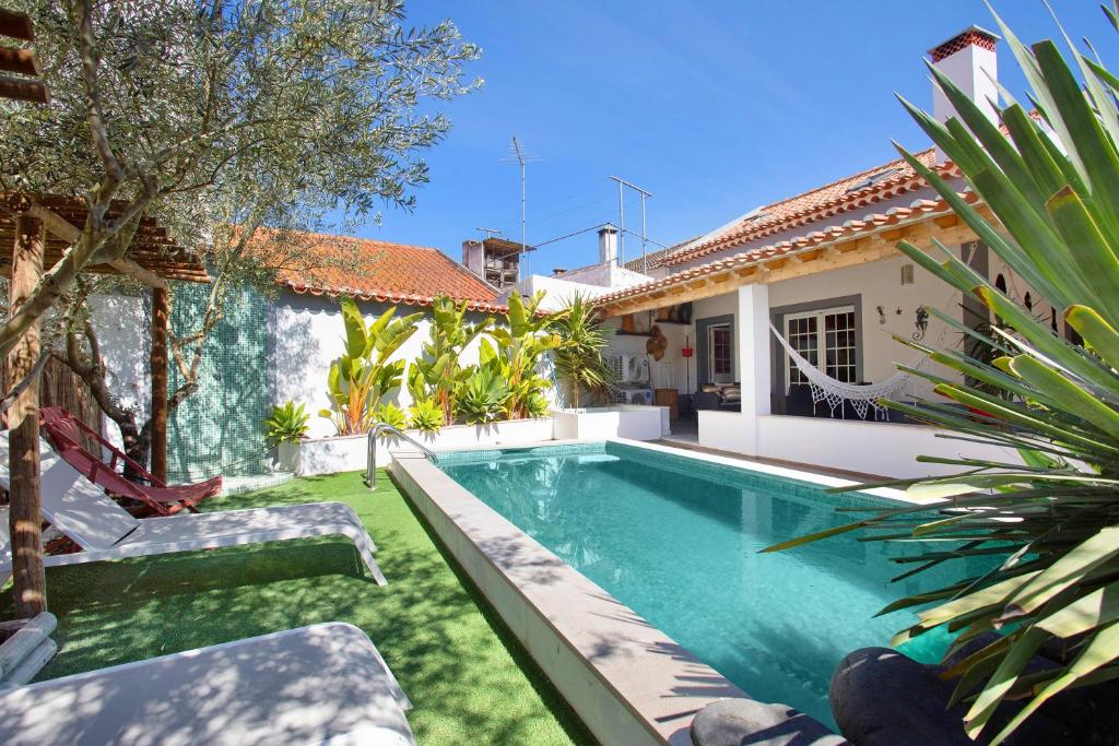 a swimming pool in the backyard of a house at Casa Holi in Valada