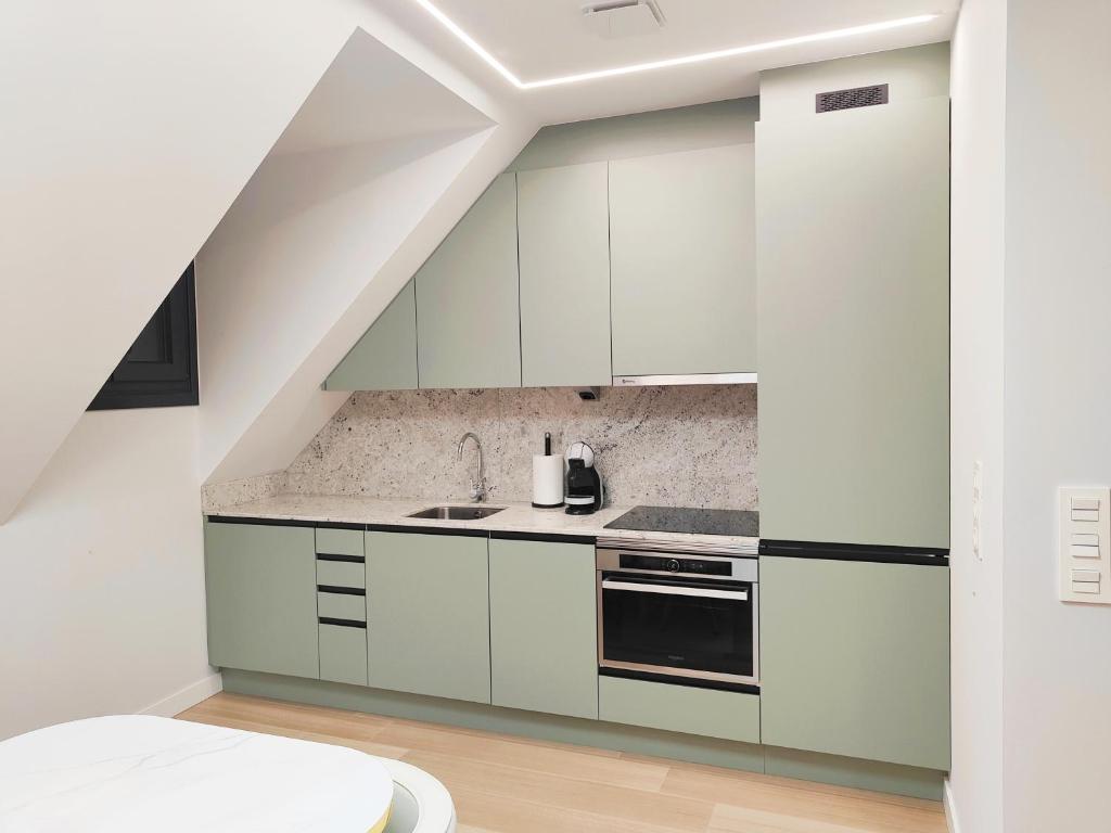 Kuchyň nebo kuchyňský kout v ubytování Apartamentos Centro Oviedo Caveda