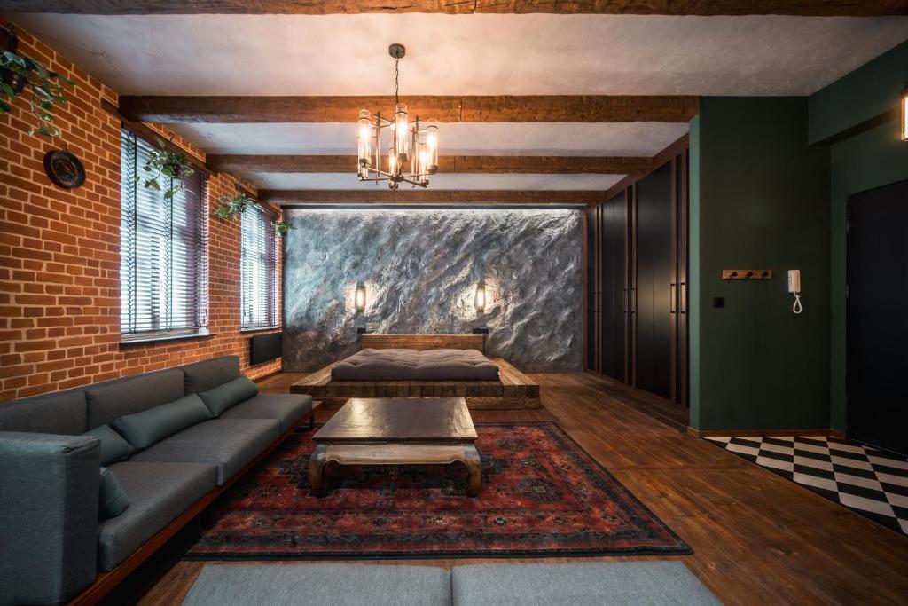 a living room with a couch and a table at Św. Antoniego in Wrocław