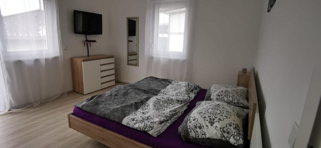 Postel nebo postele na pokoji v ubytování Ferienhaus Sole