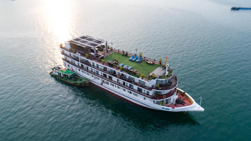 a large cruise ship in the water at Amanda Legend Cruise Ha Long Bay in Ha Long