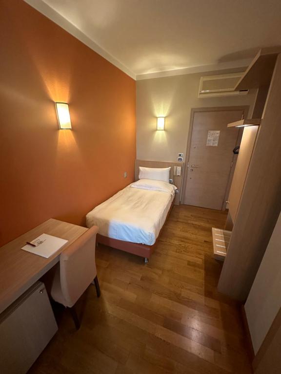 Postel nebo postele na pokoji v ubytování Hotel Dei Vicari