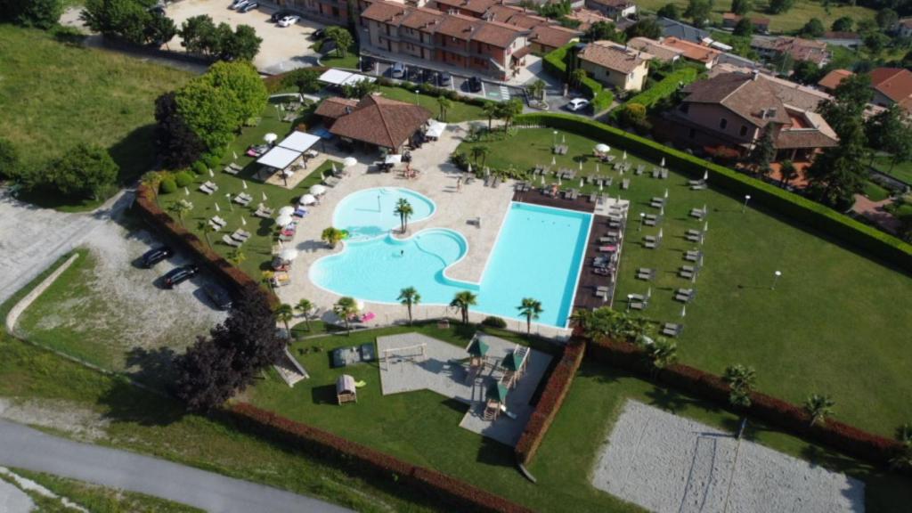 an aerial view of a resort with a swimming pool at Residence La Berna in Tremosine Sul Garda
