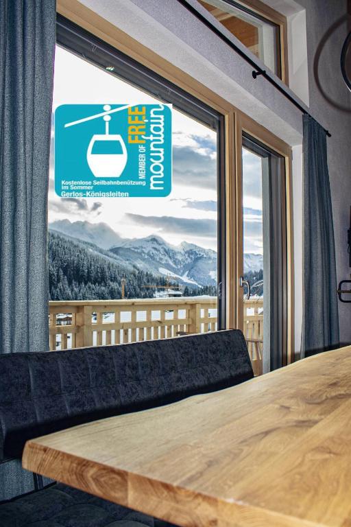 a large window with a view of a mountain at Apart. Oberhof in Gerlos