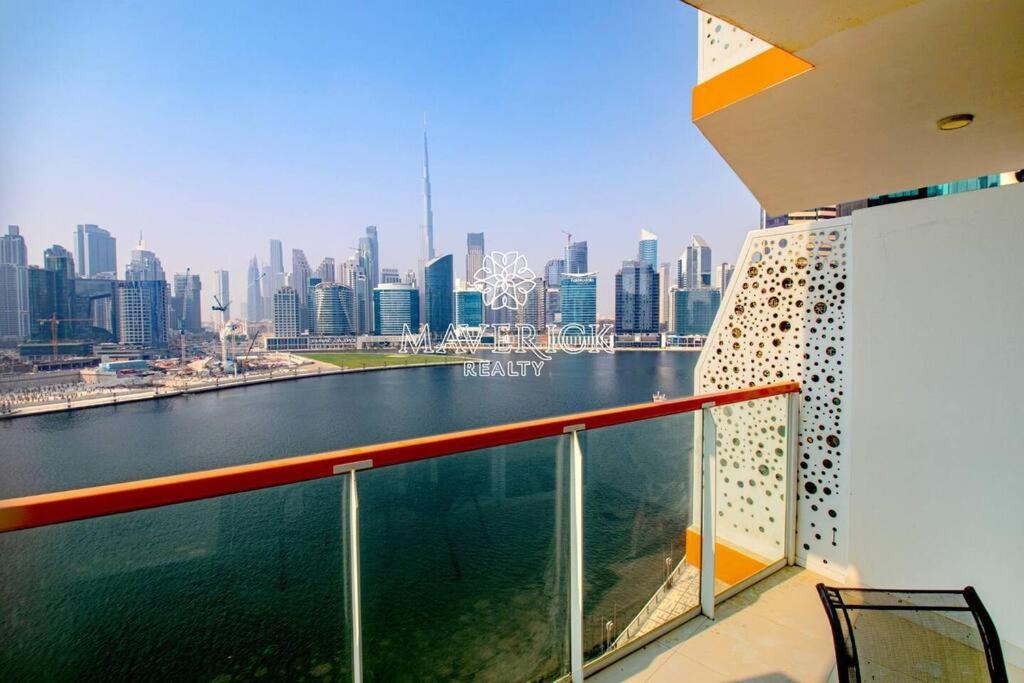 a view of the city from the balcony of a ship at Gorgeous Burj Khalifa+CanalView in Dubai