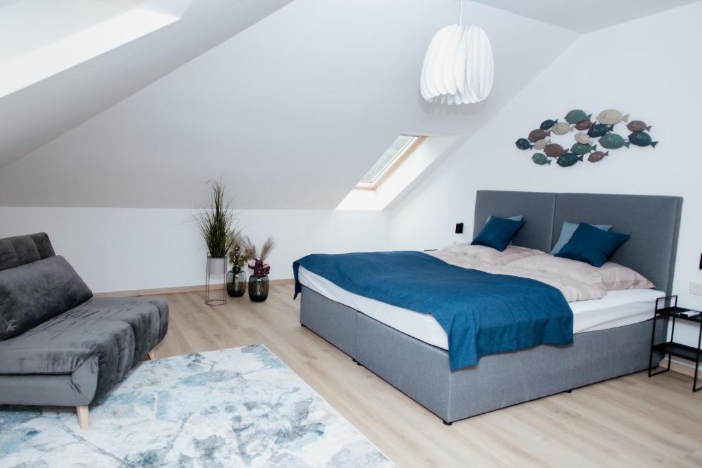 A bed or beds in a room at Zafír Home
