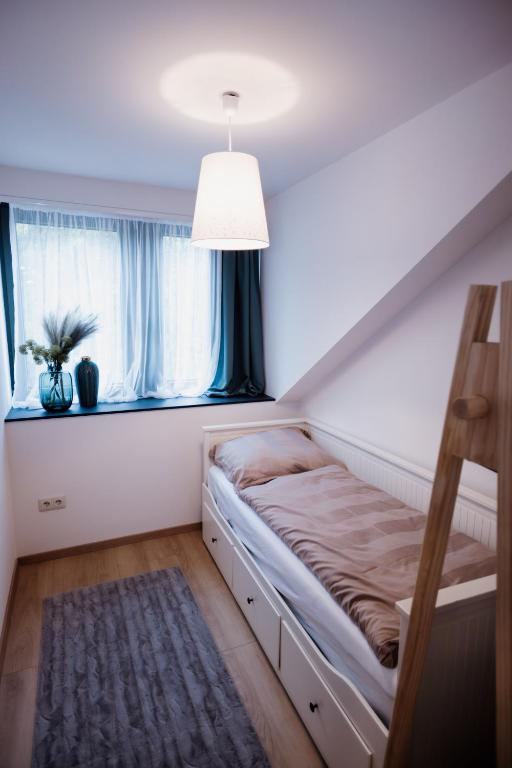 A bed or beds in a room at Zafír Home