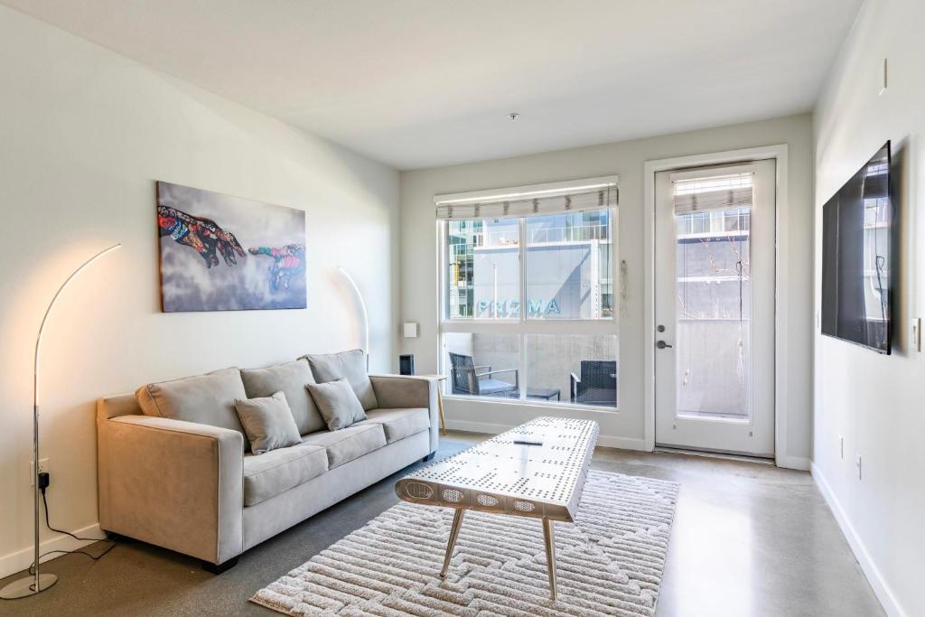 a living room with a couch and a table at New 2BR Luxury Apartment Hollywood in Los Angeles