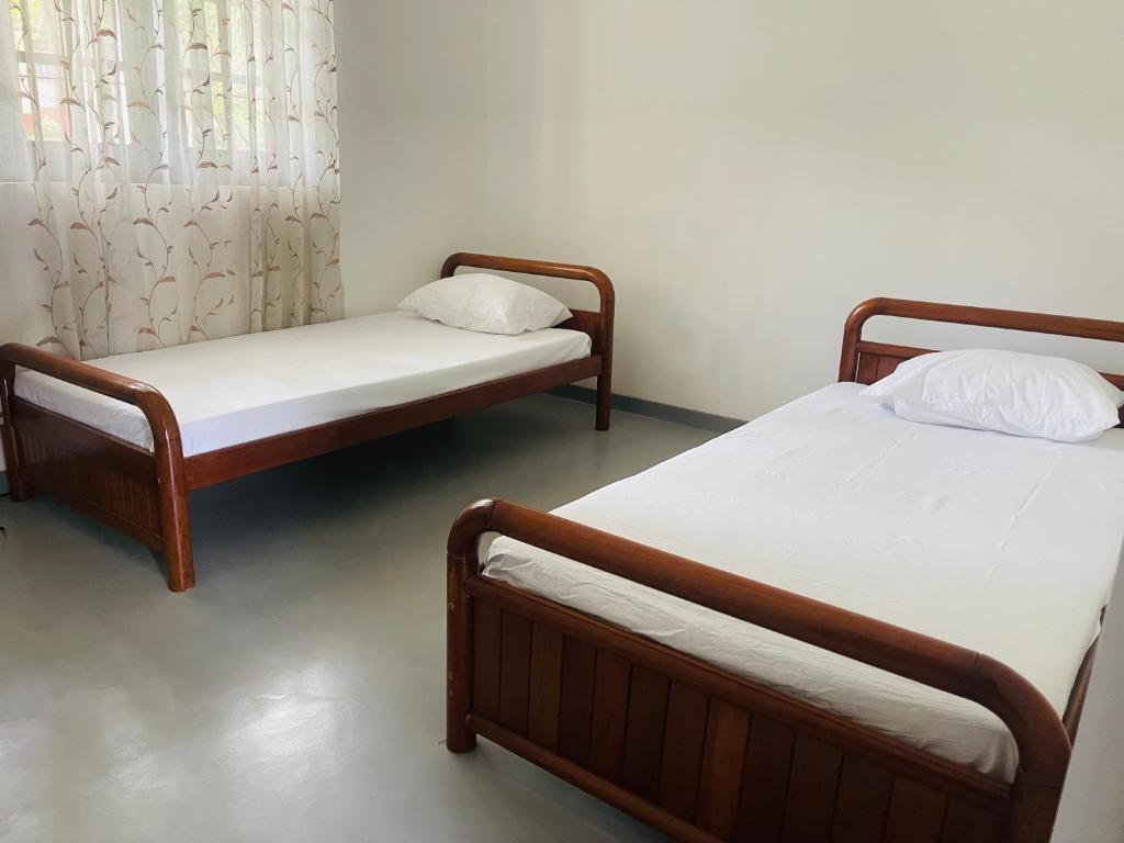 Postel nebo postele na pokoji v ubytování 1818 Badulla