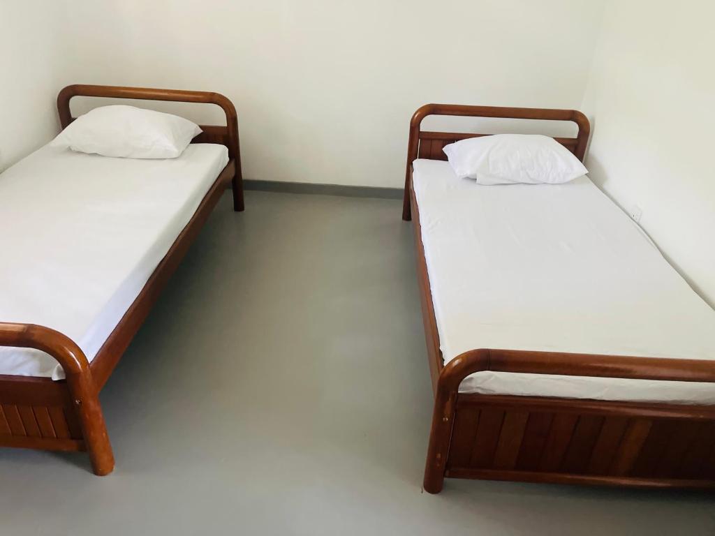 Postel nebo postele na pokoji v ubytování 1818 Badulla
