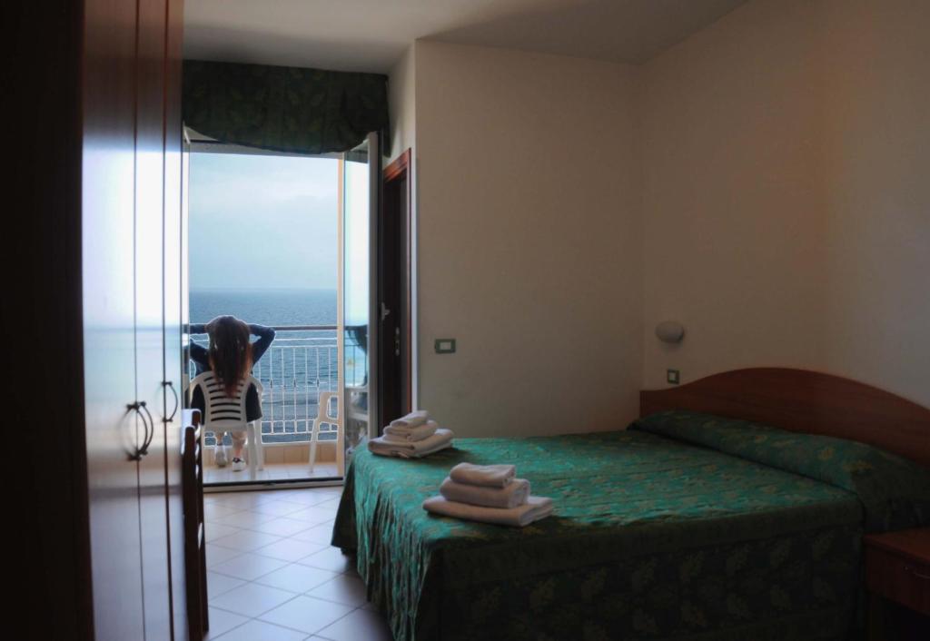 Postel nebo postele na pokoji v ubytování Hotel Belvedere
